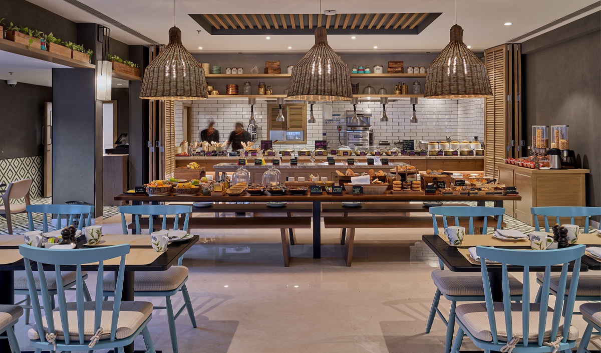 “Modern buffet restaurant interior with stylish seating and a wide spread of dishes in Bangalore”