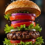 “Juicy burger with cheese, veggies and fresh toppings served in a Bangalore restaurant”