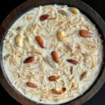 A bowl of traditional South Indian payasam garnished with nuts.