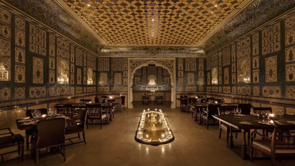 A royal-themed restaurant with ornate decor and candlelit seating.