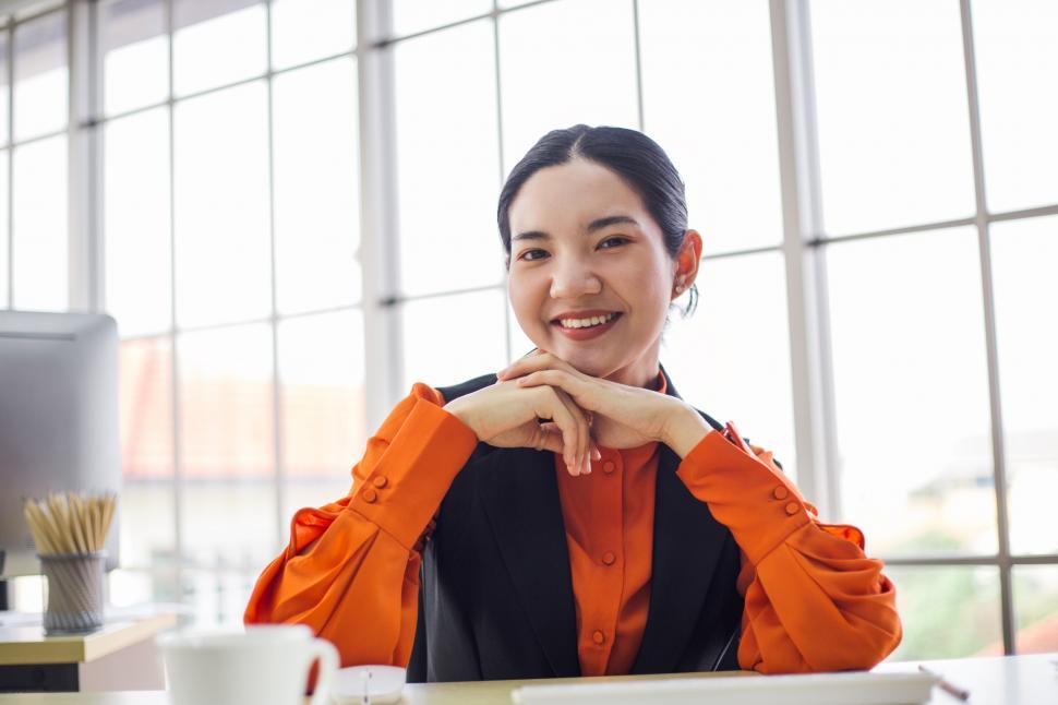 portrait of young female employee smiling at the camera