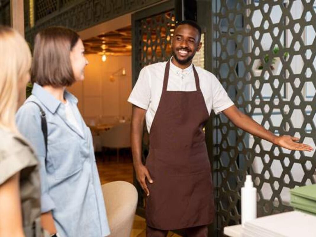 Family-friendly restaurant staff welcoming guests with care.